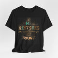 He Restores Floral Bible Verse Tee — 'He Restores What Was Lost Will Bloom Again' (Joel 2:25)